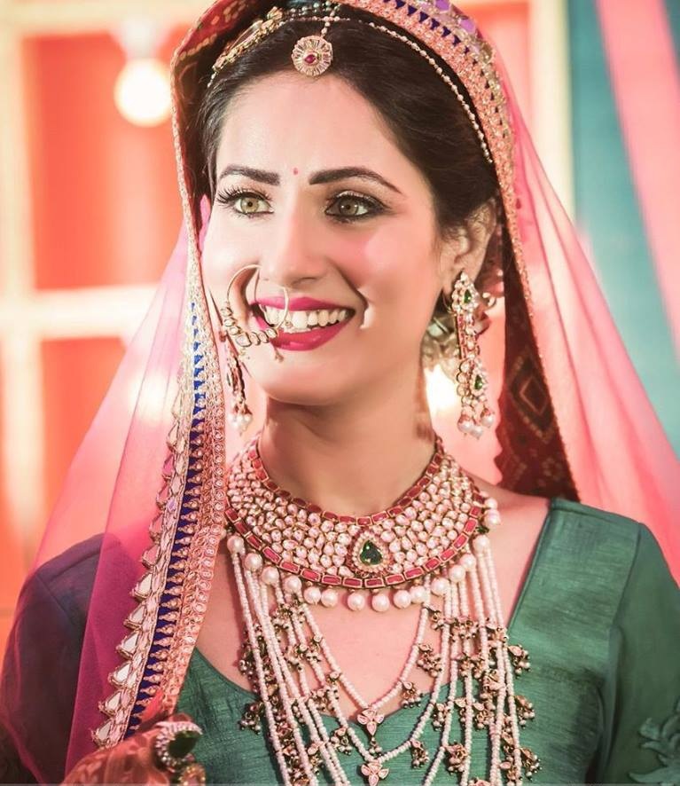 Pooja Bose Cute Smile Pics In Royal Look